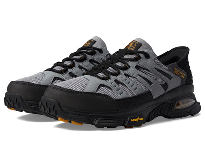 Skechers men's Air Envoy slip-on sneaker in gray and black, size 12W, featuring a casual design and breathable fabric upper.