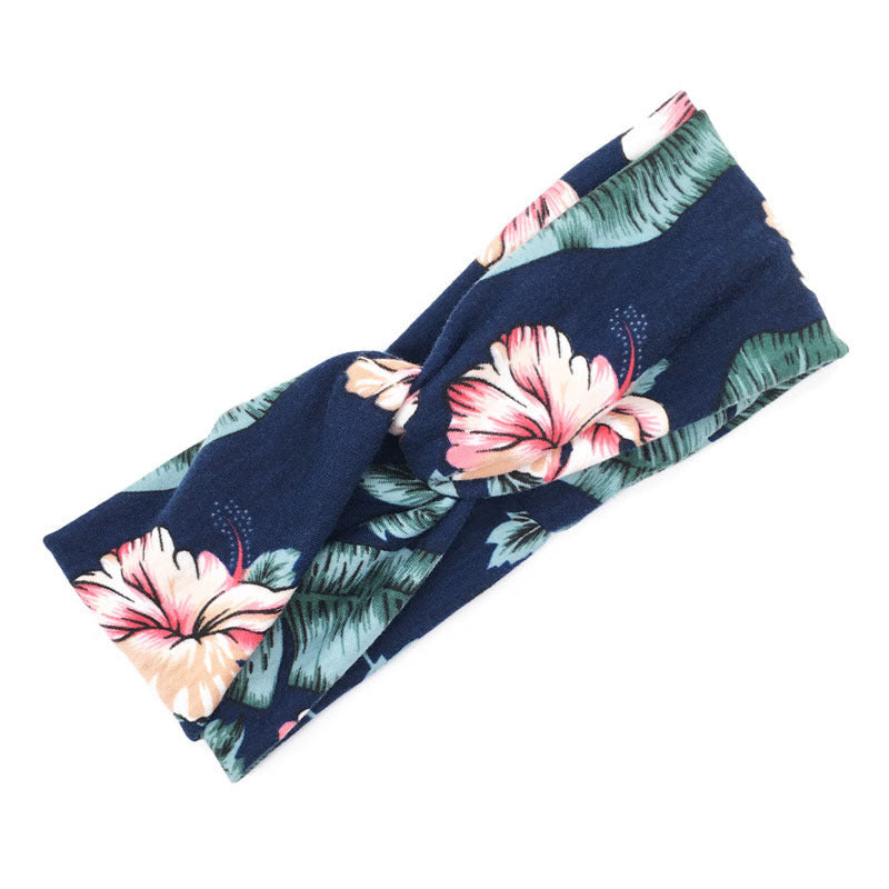 Floral cross hair band with colorful flower print and comfortable fabric design
