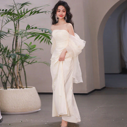 Simple long tube top light wedding dress for the bride, shown in a clean bridal silhouette