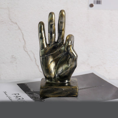 Resin gesture ornaments set with smooth sculpted details in neutral tones