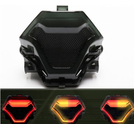 Retro motorcycle taillight, black vintage housing with red lens and chrome details