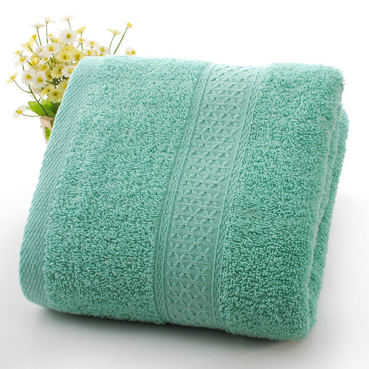 Thickened bath towel beach towel in soft, absorbent fabric, folded for display