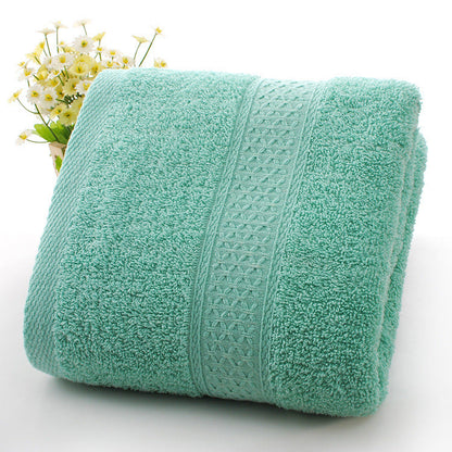 Thickened bath towel beach towel in soft, absorbent fabric, folded for display