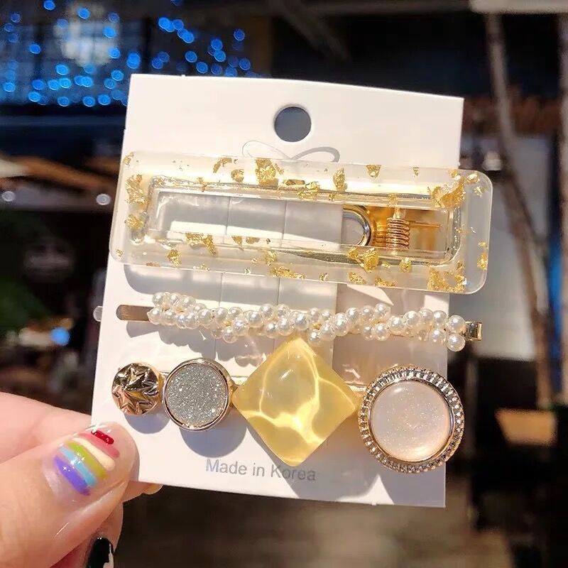 Pearl hair accessories by My Store arranged for a polished, elegant look