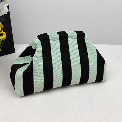 Women's knitted striped clutch bag folded in a compact rectangular shape