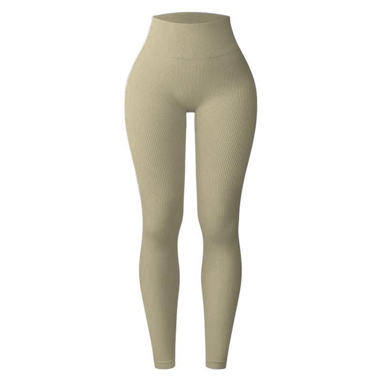 Women's high-waisted tight-fitting butt-lifting yoga pants in black with a sculpted, seamless look