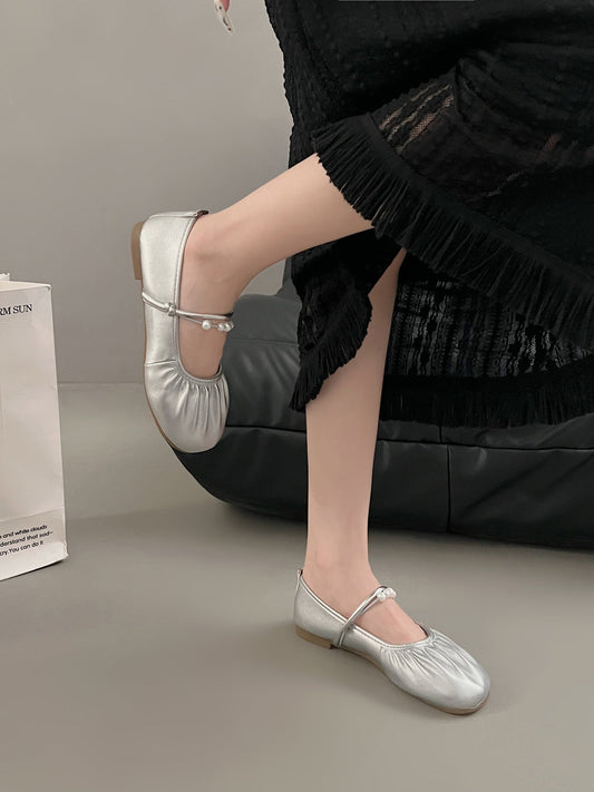 Silver Mary Jane loafers with shallow vamp, low heels, and buckle straps for women’s dress outfits