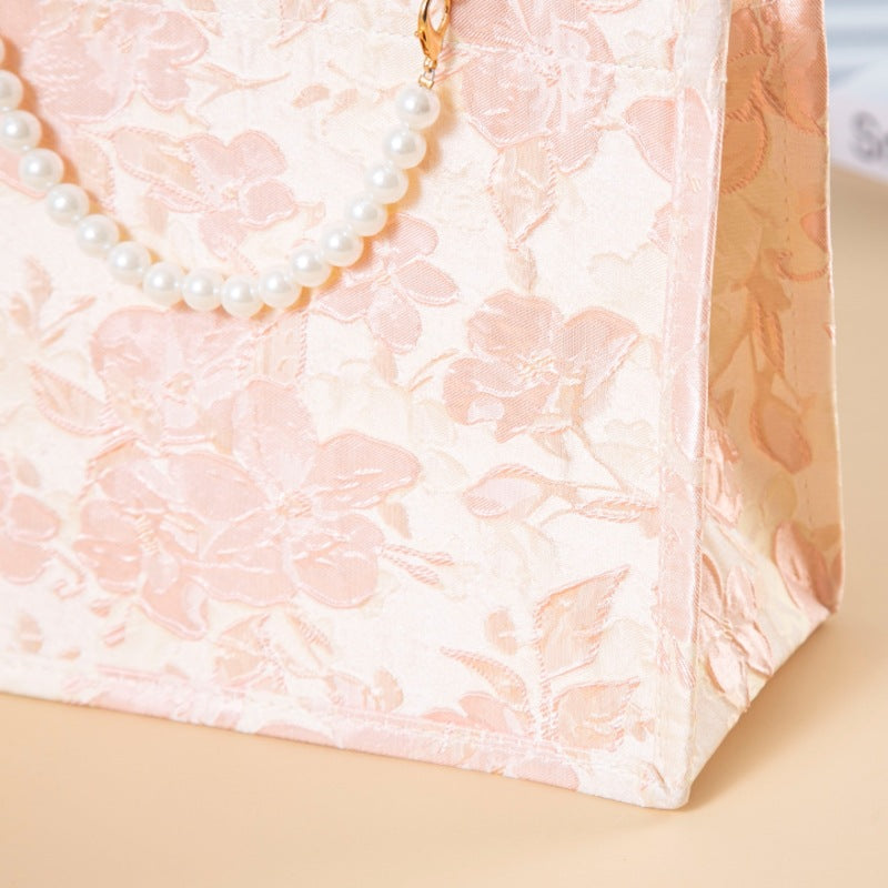 Relief-printed souvenir canvas gift bag with textured design and sturdy handles