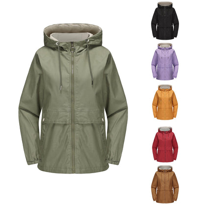 Women’s hooded solid color trench coat in a classic longline design