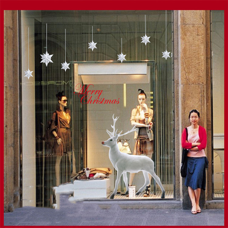 Christmas decorations store window stickers with festive holiday designs displayed on glass
