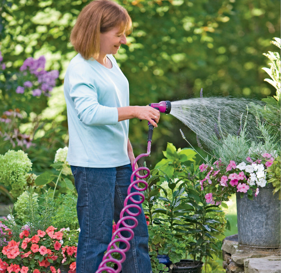 Garden telescopic hose sprinkler with adjustable spray head and extended handle setup