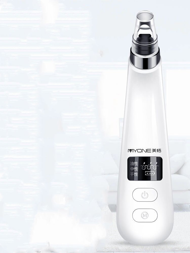 Electric blackhead remover in black, handheld skincare device close-up