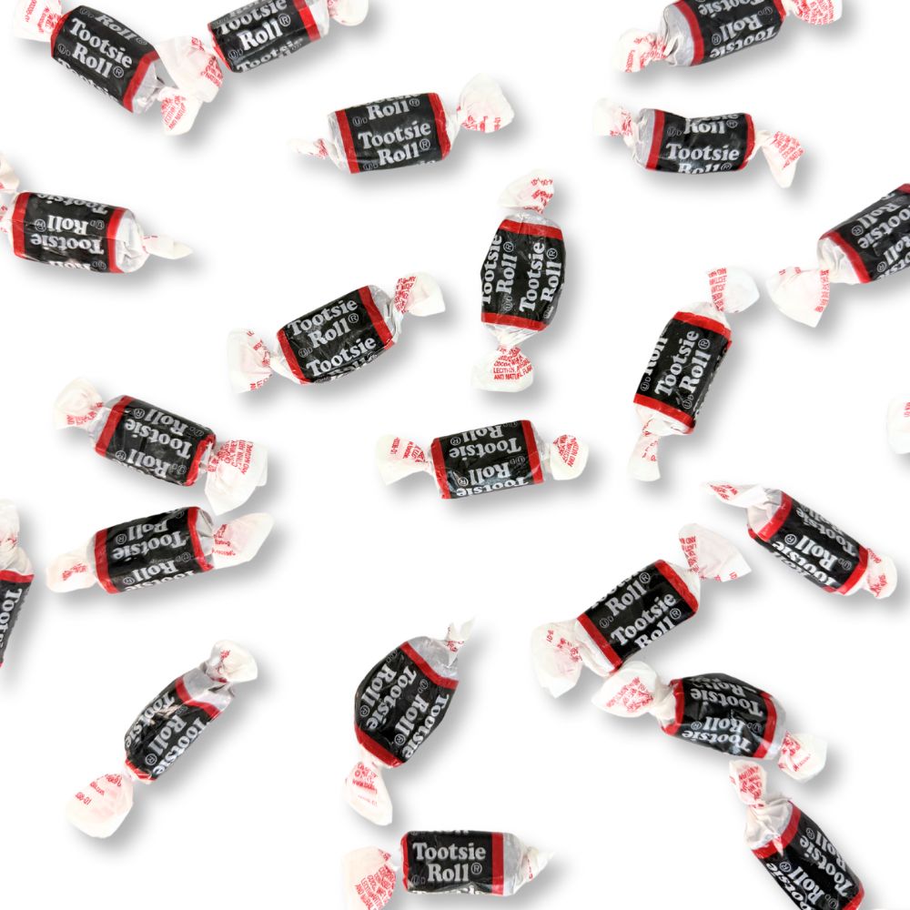 Two Tootsie Roll Midgees chewy candies from Candy In Bulk in a clear bag, showing their small, colorful, chocolate-flavored shapes.