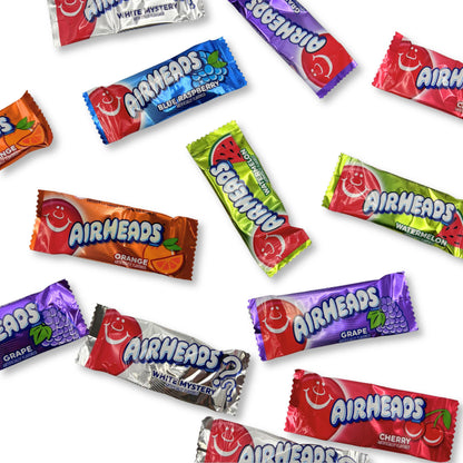 Assorted Airheads Mini Bars Candy in a bulk bag, featuring colorful, chewy candy in various flavors from Candy In Bulk.