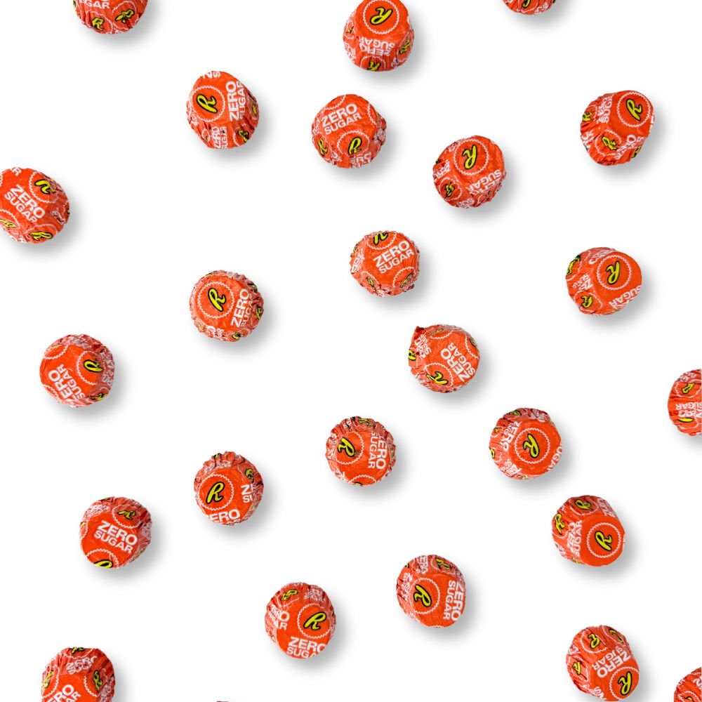 Two Reese’s Miniature Cups Zero Sugar Milk Chocolate and Peanut Butter chocolates in a bulk Candy In Bulk bag packaging.