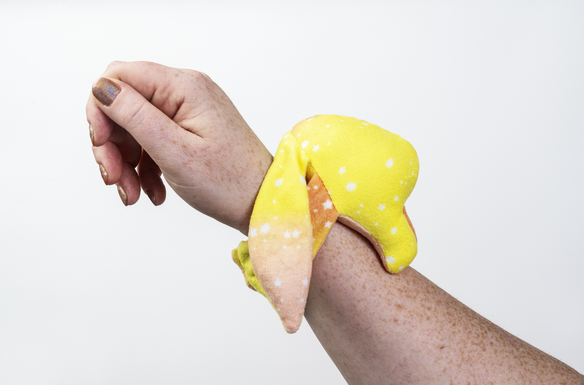 Moon Pals Spark Mini Wrist Hugger Plush in bright, soft fabric featuring a cute, colorful wrist accessory with embroidered details.