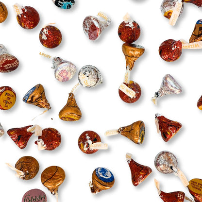 Hershey's Kisses milk chocolate candies in Harry Potter-themed foil wraps, shown in a bulk value bag from Candy In Bulk.