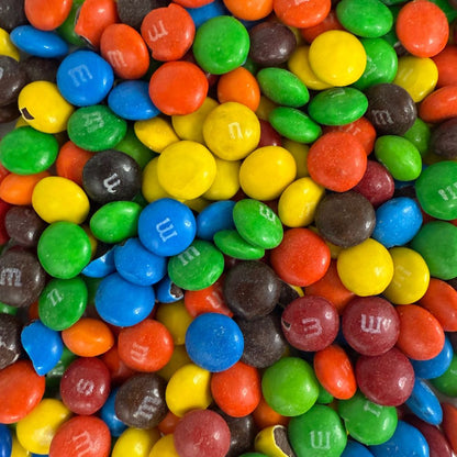 Two bags of M&M's Milk Chocolate Candy from Candy In Bulk, showing colorful chocolate-coated candies in a bulk value bag.