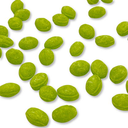 Two green apple flavored Claeys hard candy drops in a bulk value bag from Candy In Bulk, showing bright green candies with a glossy finish.