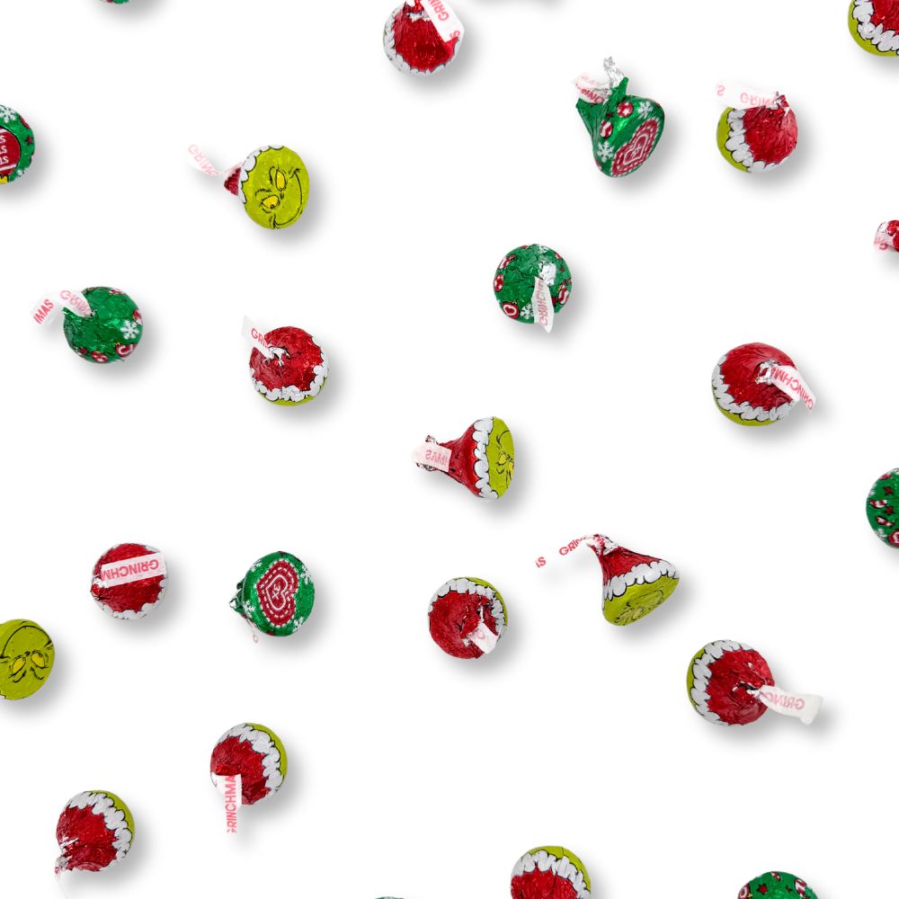 Hershey's Kisses Milk Chocolate Grinch candies in bulk, featuring festive green and red foil wrapping, from Candy In Bulk.
