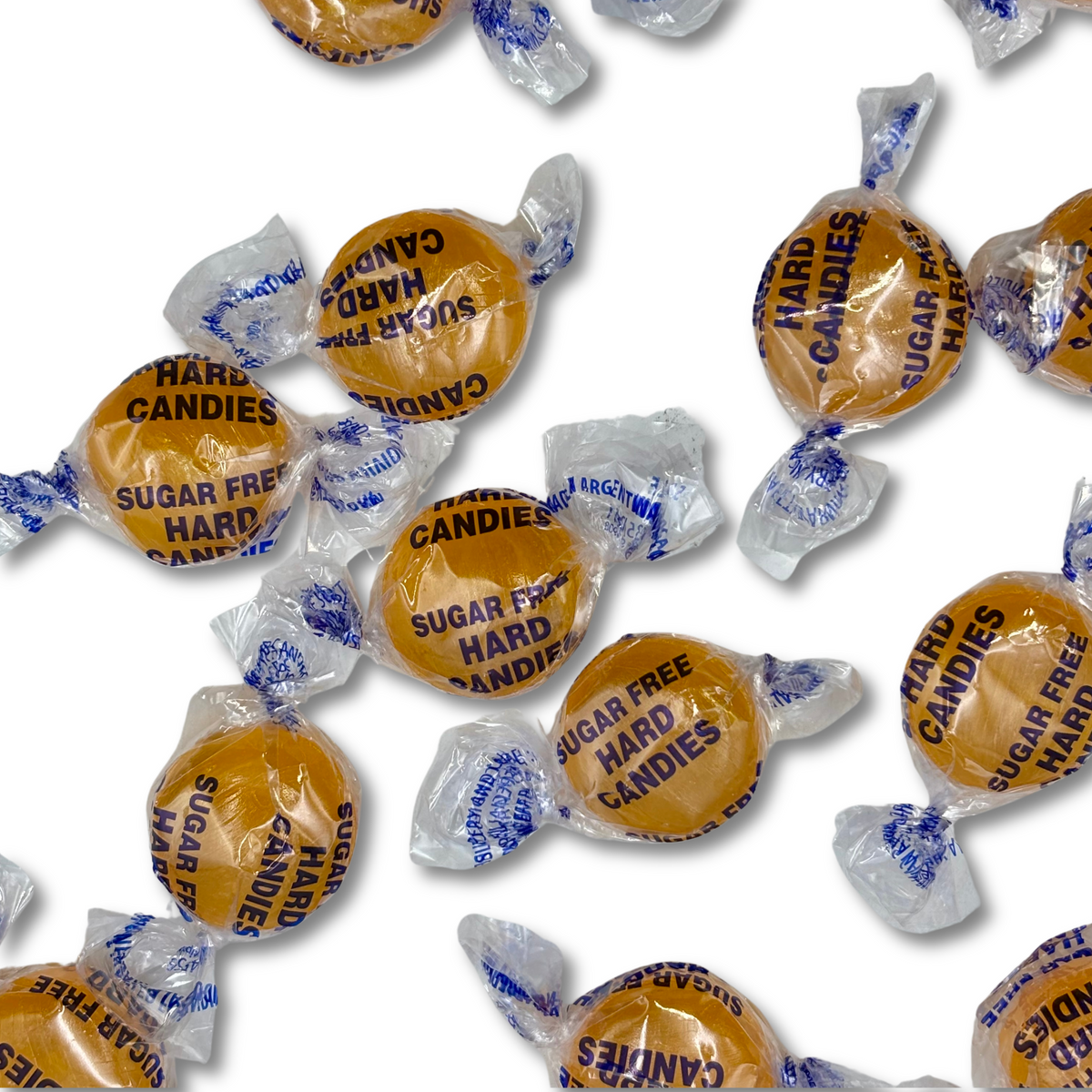 Two pieces of Arcor Butterscotch Sugar Free Hard Candy from Candy In Bulk in a clear bag, showcasing their golden color and smooth texture.