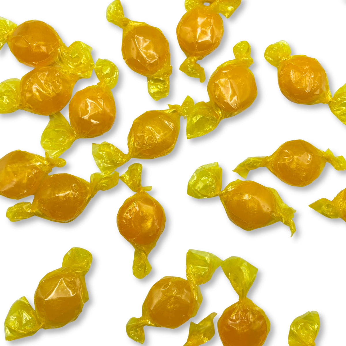 Two butterscotch buttons hard candies from Candy In Bulk in a clear plastic bag, showcasing their round shape and golden color.