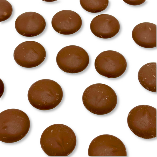 Two bags of Candy In Bulk Merckens milk chocolate-flavored candy coating and melting wafers in a bulk value bag.