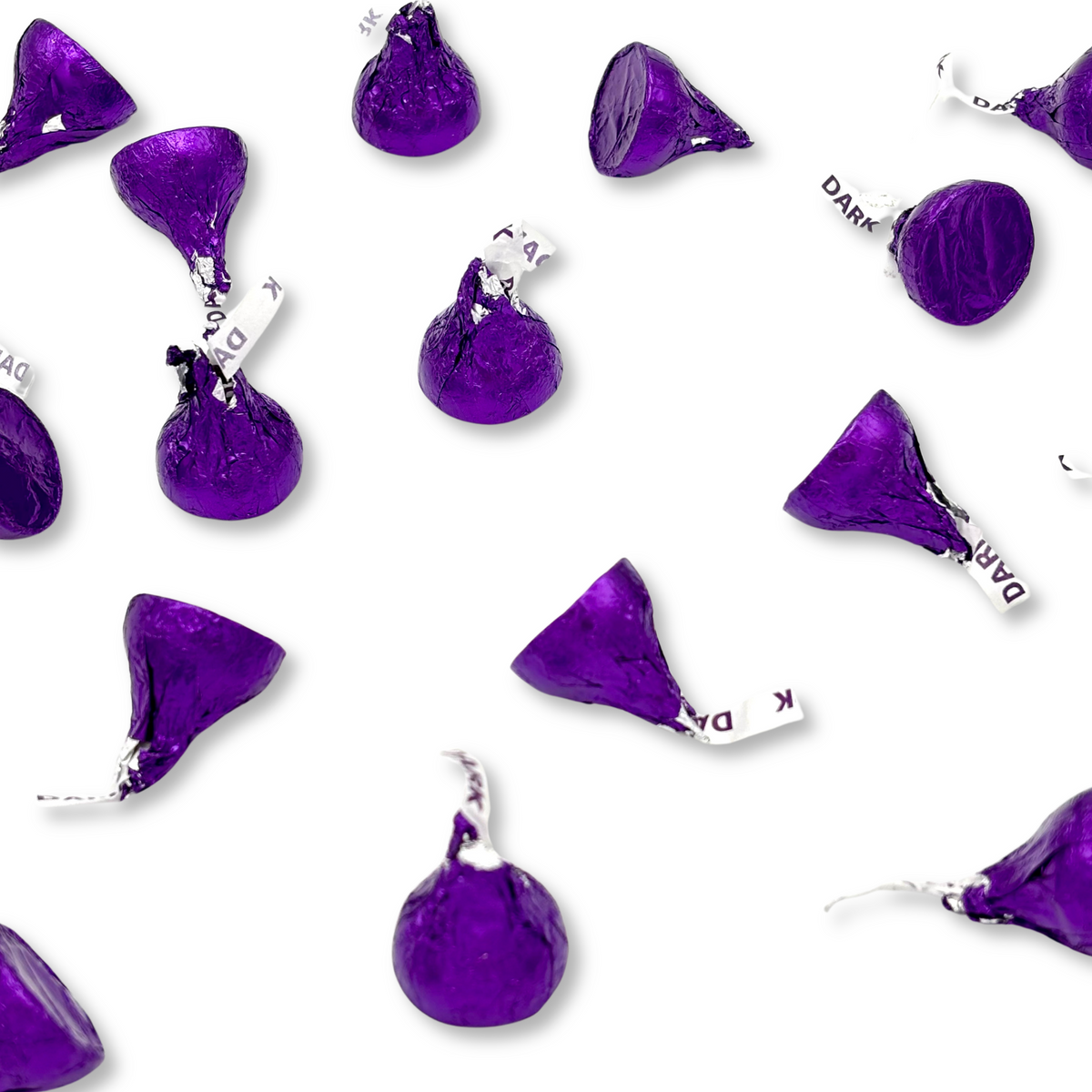 Two Hershey's Kisses Special Dark Mildly Sweet Chocolate candies from Candy In Bulk's bulk value bag, showing the foil-wrapped chocolates.