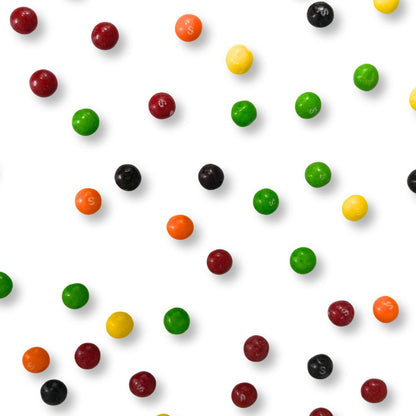 Colorful Skittles Original Fruit Candy in a bulk bag by Candy In Bulk, showing bright, assorted fruit-flavored candies.