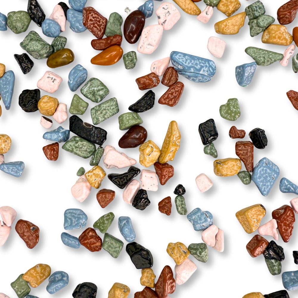 Two handfuls of Candy In Bulk Kimmie Candy Choco Rocks with crunchy chocolate pebbles in a bulk value bag.