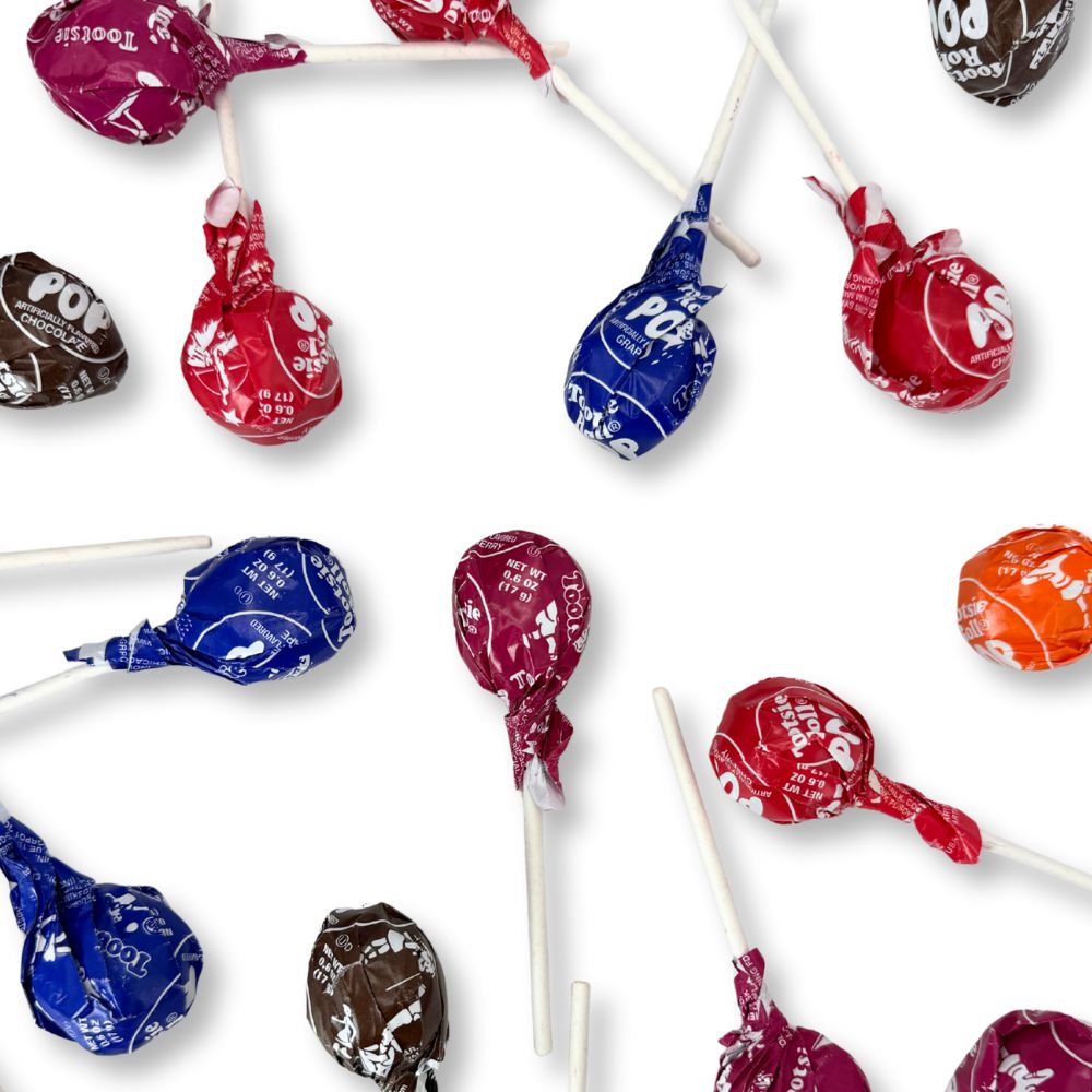 Assorted Tootsie Roll Pops lollipops from Candy In Bulk in a bulk value bag, featuring colorful, round candies on sticks.
