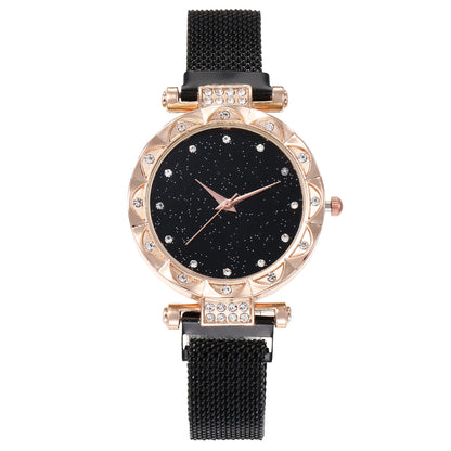 Women's magnetic strap quartz wristwatch close-up with a sleek metal mesh band and classic round dial