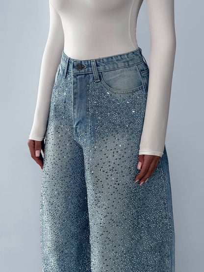 Irregular rhinestone jeans from Anybestbuy Store featuring distressed denim with scattered rhinestones and unique design details.