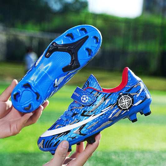 Children's football shoes with Velcro straps and spike soles for sports, black and white design