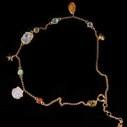Summer forest-style starfish and shell anklet for women, featuring coastal charms on a delicate chain