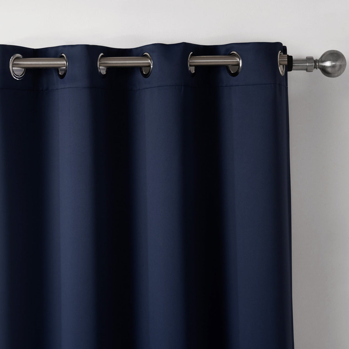 Dark blue bedroom blackout fabric printed curtains on a window