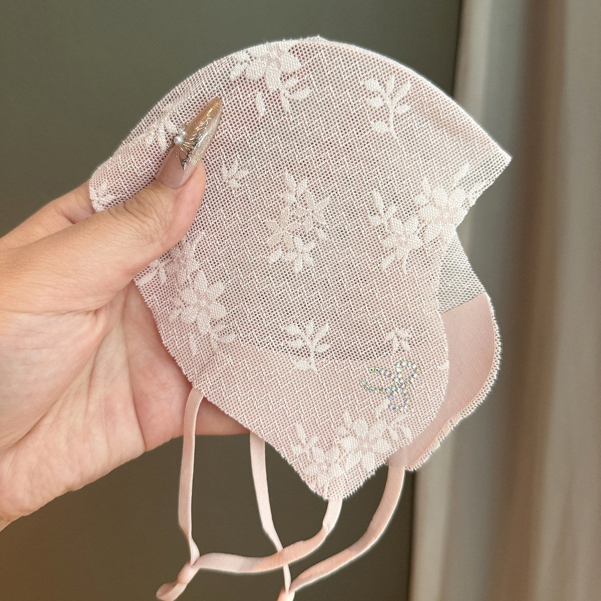Sun-protective washable face mask with sunshade coverage, shown in a simple design