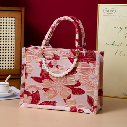 Relief-printed souvenir canvas gift bag with textured design and sturdy handles