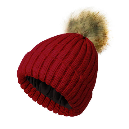 Women's solid-color brimmed hat with satin pom-pom detail, front view
