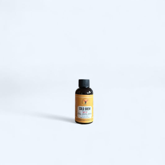 2oz Rising For People Coffee Co. cold brew concentrate in a small bottle, ideal for travel and making iced coffee at home