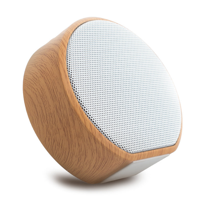 Wood grain Bluetooth speaker with natural finish and compact design