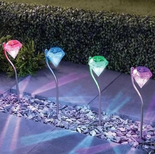 Solar powered garden diamond light with faceted diamond design and decorative outdoor stake