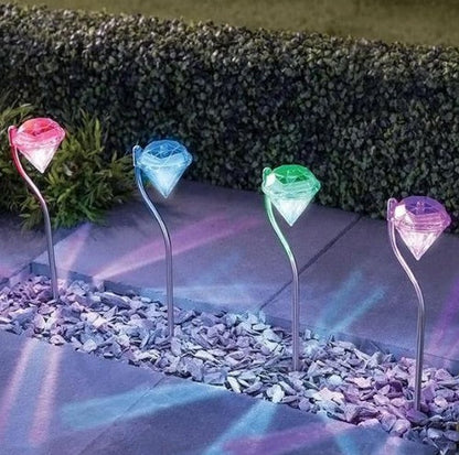 Solar powered garden diamond light with faceted diamond design and decorative outdoor stake