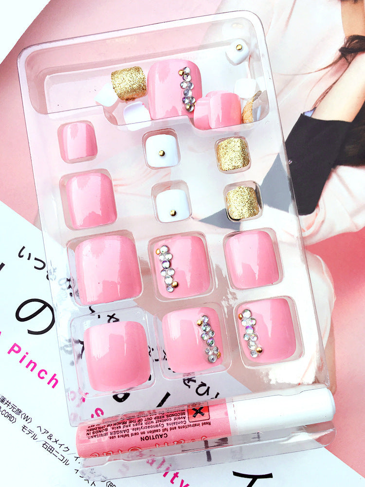 24-piece professional artificial acrylic toe nail patches in assorted sizes, displayed on a clear nail tip holder