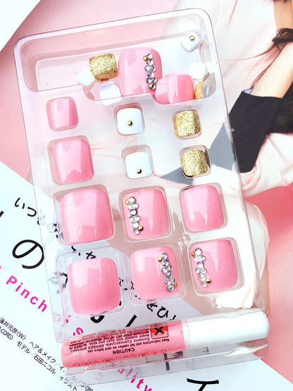 24-piece professional artificial acrylic toe nail patches in assorted sizes, displayed on a clear nail tip holder