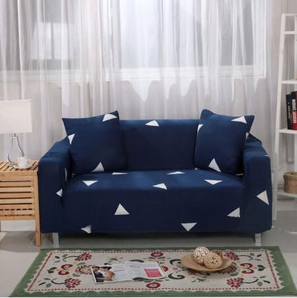 Elastic universal sofa cover in neutral fabric stretched over a sofa.
