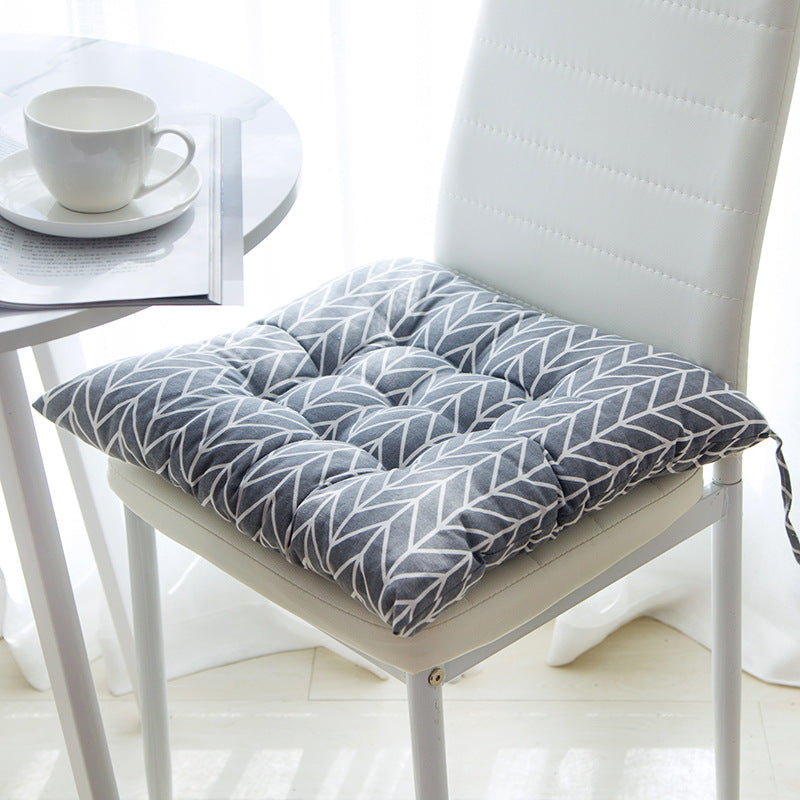 Summer chair cushion in a light, breathable fabric for outdoor seating