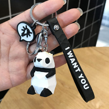 Cute dinosaur keychain key ring in green novelty design, close-up product view
