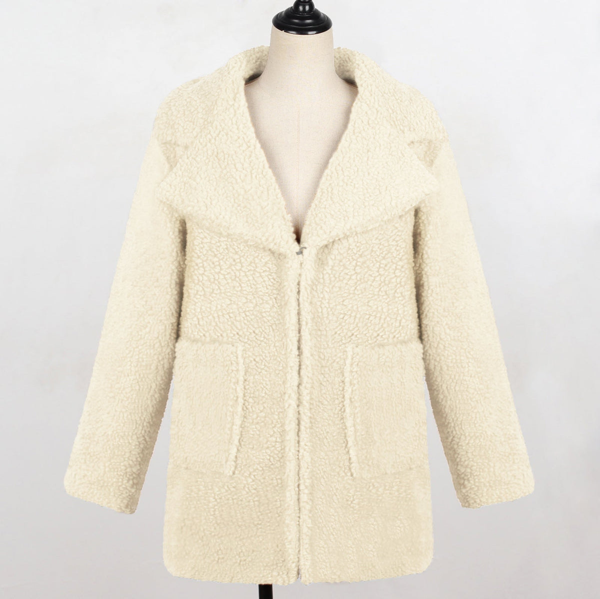 Long faux fur suit collar women’s casual coat in soft brown fur posing outdoors