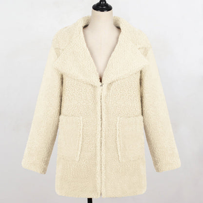 Long faux fur suit collar women’s casual coat in soft brown fur posing outdoors